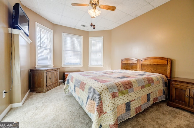 bedroom featuring light carpet and ceiling fan