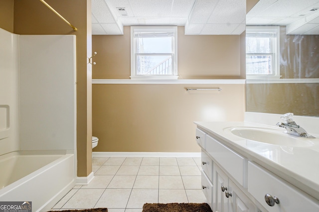 full bathroom featuring a paneled ceiling, tile patterned floors, plenty of natural light, and vanity