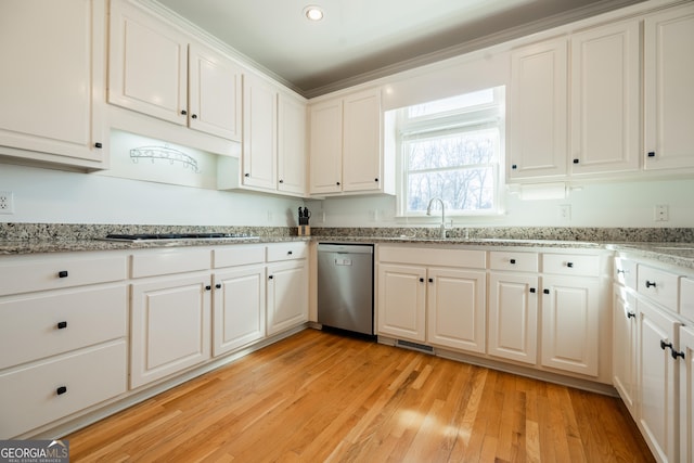 kitchen with light stone countertops, dishwasher, white cabinetry, gas cooktop, and light hardwood / wood-style flooring