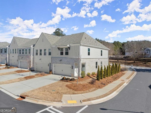 view of side of property with a garage