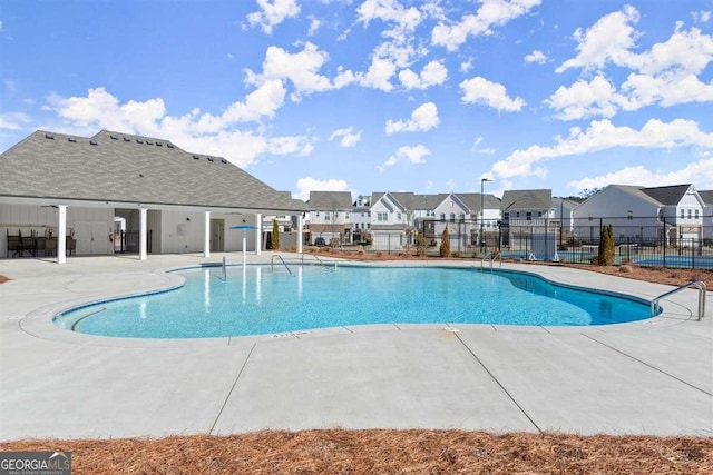 view of swimming pool with a patio