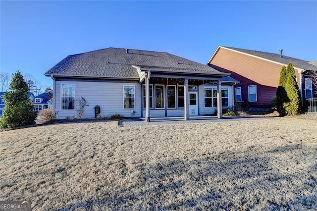 rear view of house featuring a patio