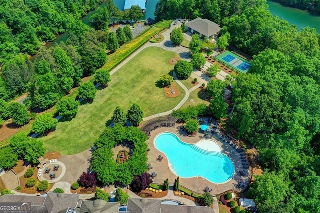 birds eye view of property with a water view