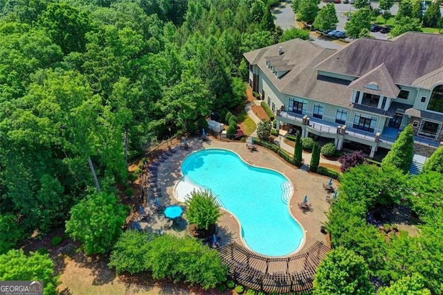 community pool with a patio area