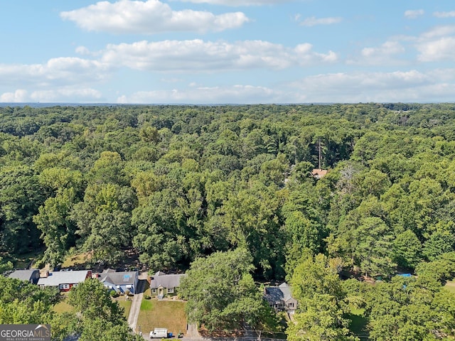 drone / aerial view featuring a view of trees