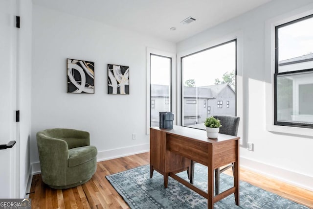 office area with hardwood / wood-style flooring