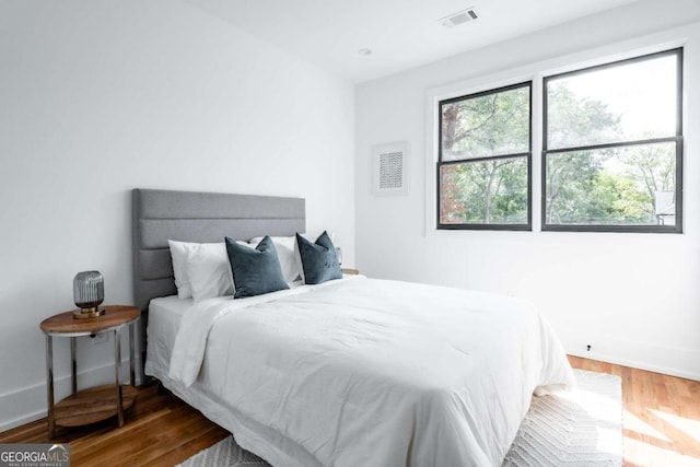 bedroom with wood-type flooring