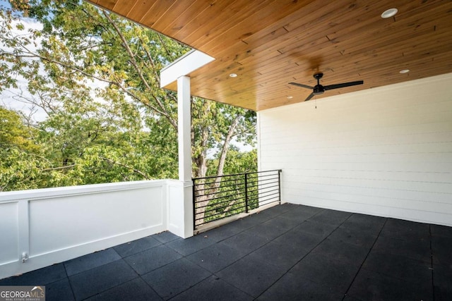 view of patio with a balcony and ceiling fan