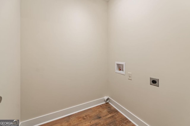 laundry area with hookup for a washing machine, dark wood-type flooring, hookup for an electric dryer, laundry area, and baseboards