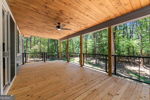 wooden terrace with a ceiling fan