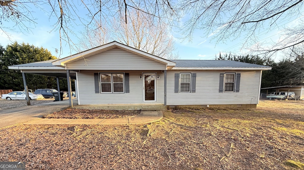 view of front of house featuring a carport