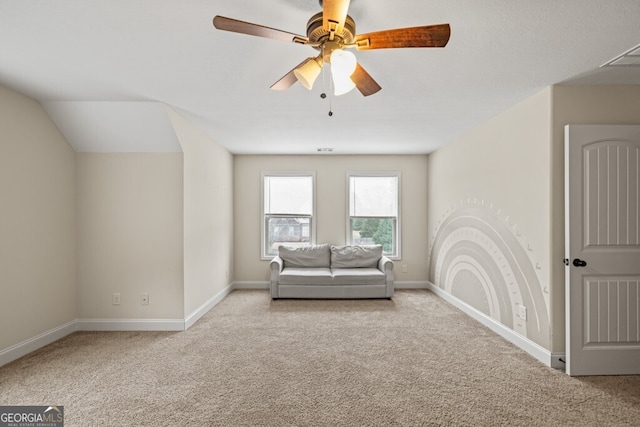 unfurnished room with ceiling fan and light carpet