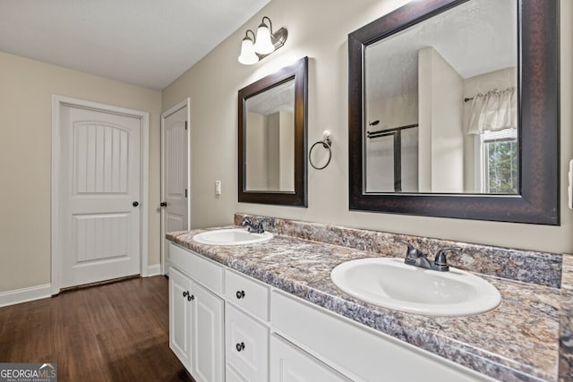 bathroom featuring vanity and hardwood / wood-style flooring