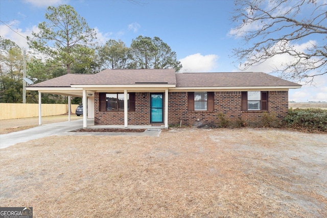 view of front of home featuring a carport