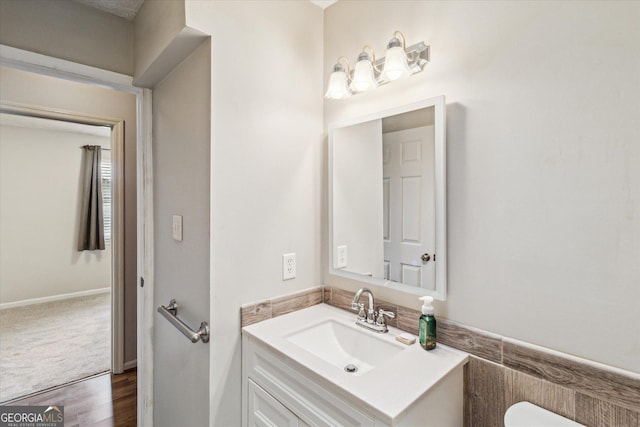 bathroom featuring hardwood / wood-style flooring and vanity