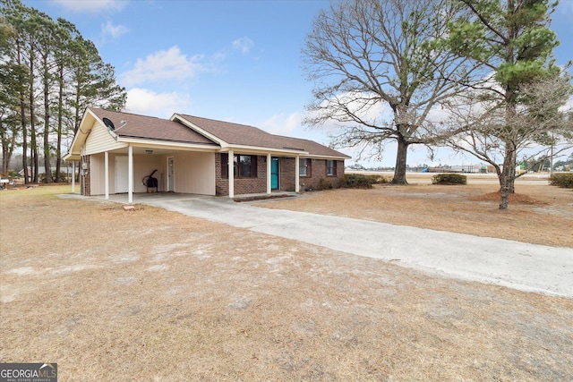 ranch-style house with a carport