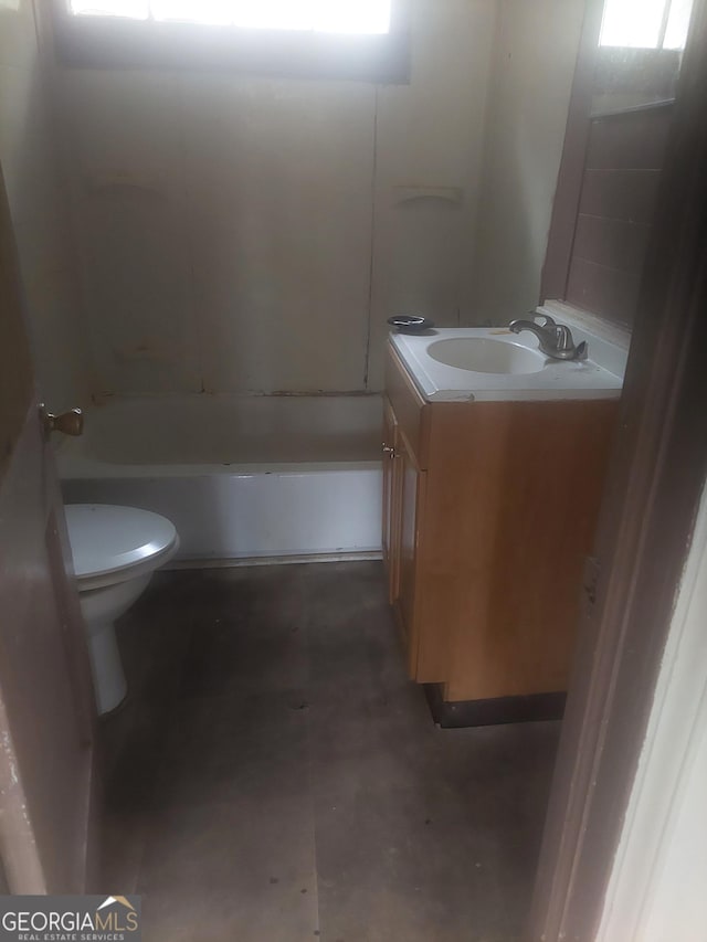 bathroom featuring toilet and vanity