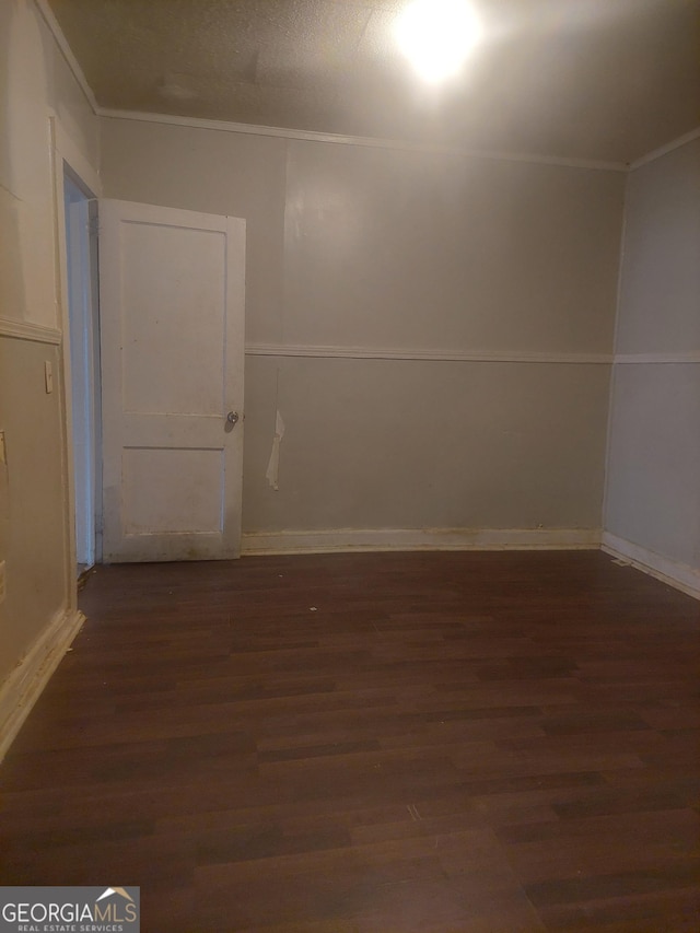 additional living space with dark hardwood / wood-style flooring