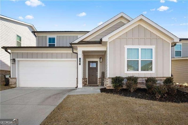 view of front of property with a garage, driveway, and board and batten siding