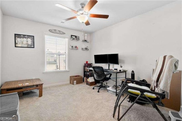 office with light carpet, ceiling fan, and baseboards