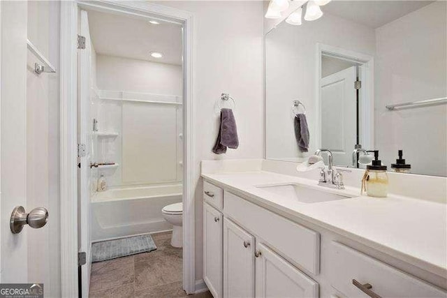 full bath with toilet, shower / tub combination, and vanity