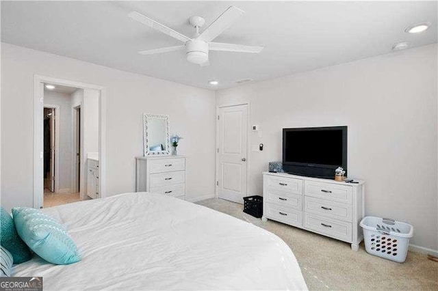 bedroom featuring light carpet, ceiling fan, and baseboards