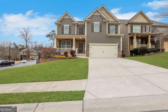 craftsman house featuring a garage, covered porch, and a front lawn