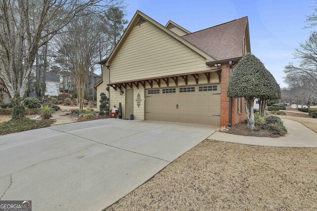 view of side of home with a garage