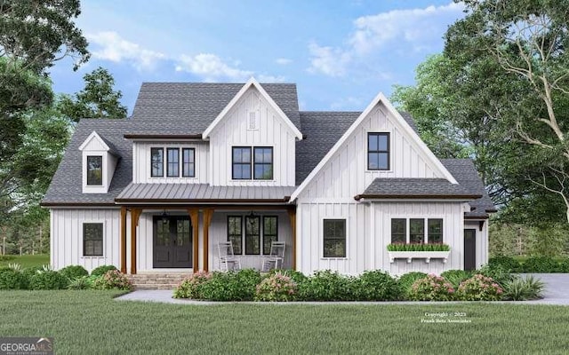 modern farmhouse style home with board and batten siding, a shingled roof, and a front lawn