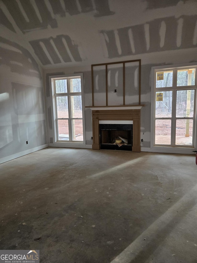 unfurnished living room featuring a fireplace