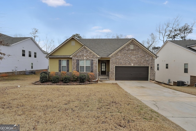 view of front of house with a garage and a front lawn