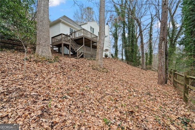 back of property with a wooden deck