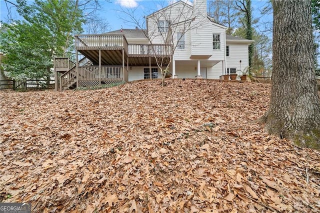 rear view of house with a wooden deck