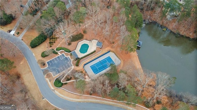 birds eye view of property with a water view