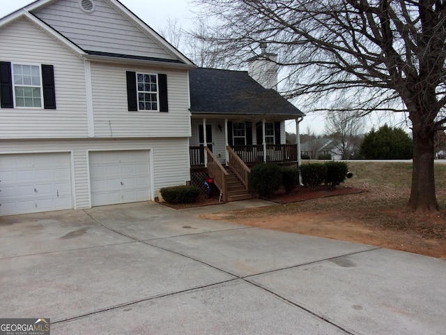 view of front of home with a porch and a garage