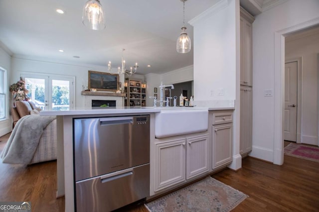 kitchen with stainless steel dishwasher, sink, decorative light fixtures, kitchen peninsula, and dark hardwood / wood-style flooring