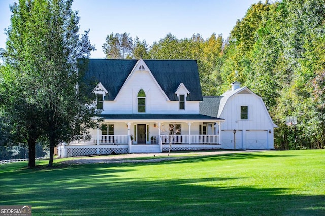 view of front facade featuring a porch, an outdoor structure, a gambrel roof, roof with shingles, and a front lawn