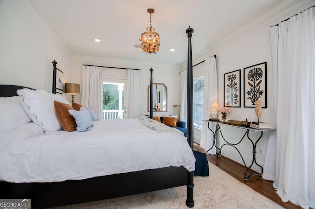 bedroom featuring hardwood / wood-style flooring and ornamental molding