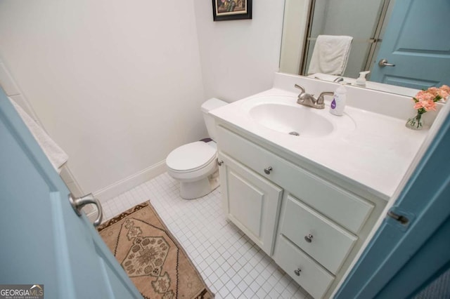 105 Fuller Dr, Carrollton, GA 30117 - bathroom featuring toilet, tile patterned floors, baseboards, and vanity