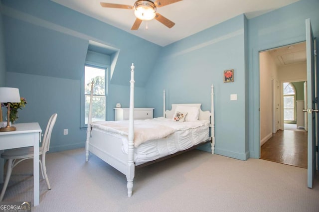 105 Fuller Dr, Carrollton, GA 30117 - carpeted bedroom featuring attic access, vaulted ceiling, baseboards, and ceiling fan