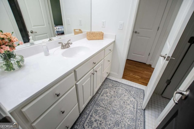 bathroom with tile patterned flooring and vanity