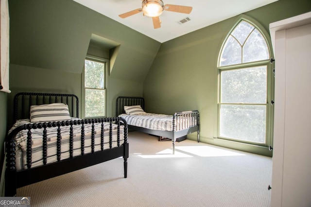 105 Fuller Dr, Carrollton, GA 30117 - carpeted bedroom featuring ceiling fan, visible vents, and vaulted ceiling
