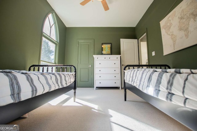 bedroom featuring ceiling fan and light colored carpet