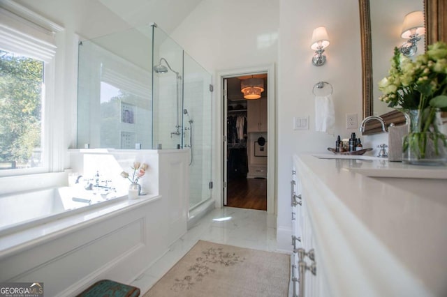 105 Fuller Dr, Carrollton, GA 30117 - full bath featuring marble finish floor, a shower stall, a walk in closet, and vanity