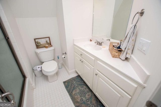 bathroom featuring toilet, tile patterned flooring, a shower with shower door, and vanity