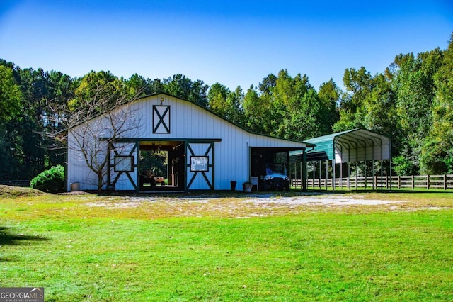 view of outdoor structure with a yard and a carport