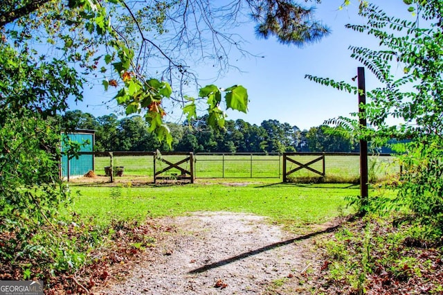 view of yard with a rural view