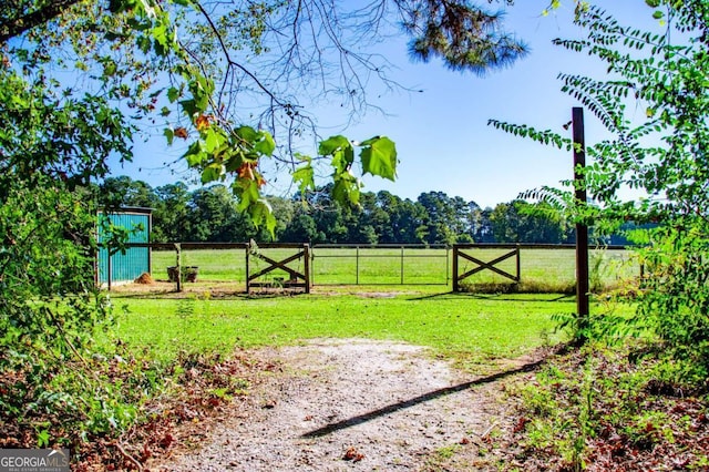 105 Fuller Dr, Carrollton, GA 30117 - view of gate with a lawn and fence