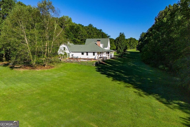 105 Fuller Dr, Carrollton, GA 30117 - exterior space featuring a forest view and a front yard
