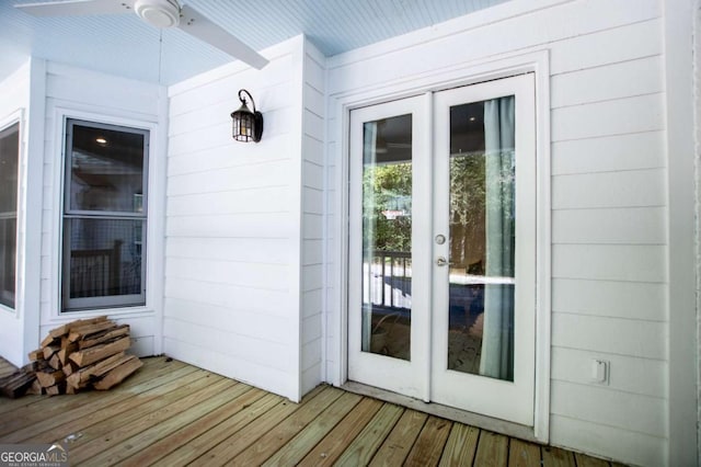 view of exterior entry with ceiling fan and french doors